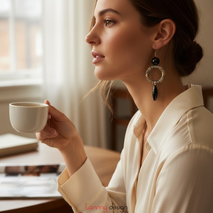 Round metal earrings with black onyx